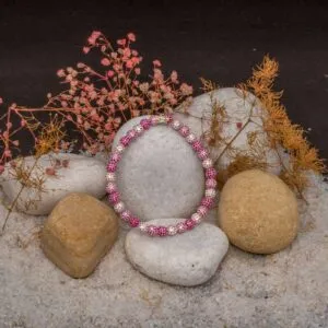 JBRC1016 — THE ROSA ORBS: Pink and white stone-set spheres create a bright, rounded sequence with a lively play of colour and light.